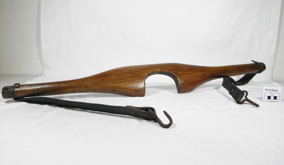 Wooden yoke with leather straps and hooks