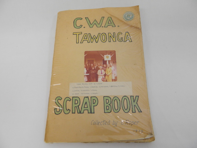 Faded scrapbook with sepia image on cover