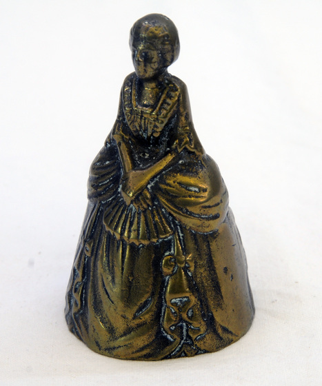 Hand bell shaped as woman in dress