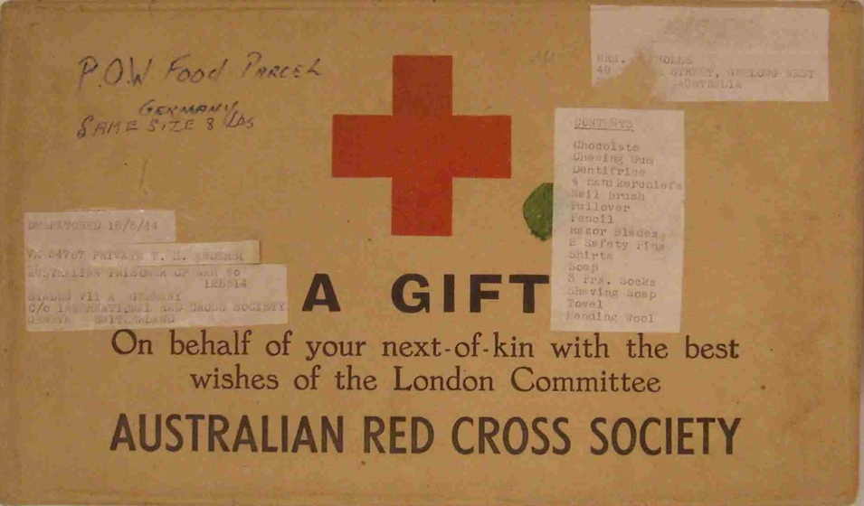 Box with printed text stickers and red cross