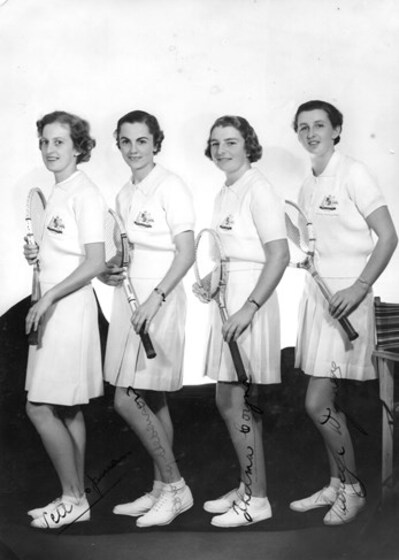 Australian Women’s Tennis team in uniform standing side by side, black and white