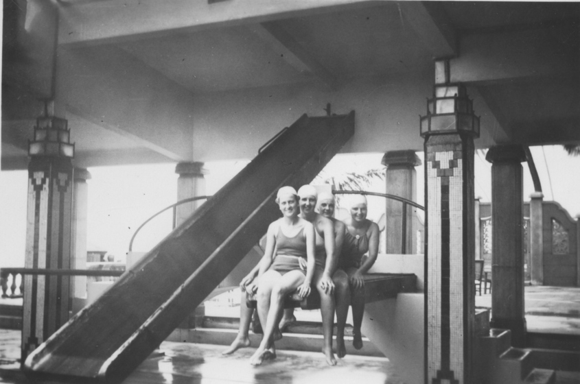 Australian women's tennis team on a diving board at Colombo hotel, black and white