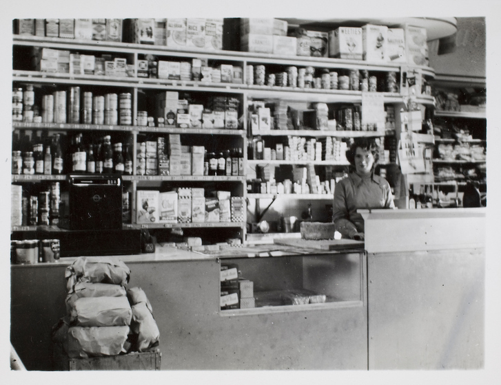 Woman standing in front of shelving