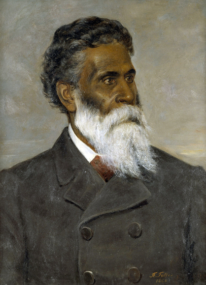 portrait of a bearded man in suit looking to the right