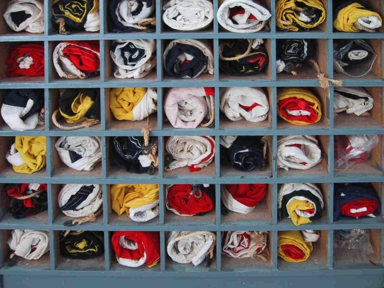 Flags rolled up and stored in shelves