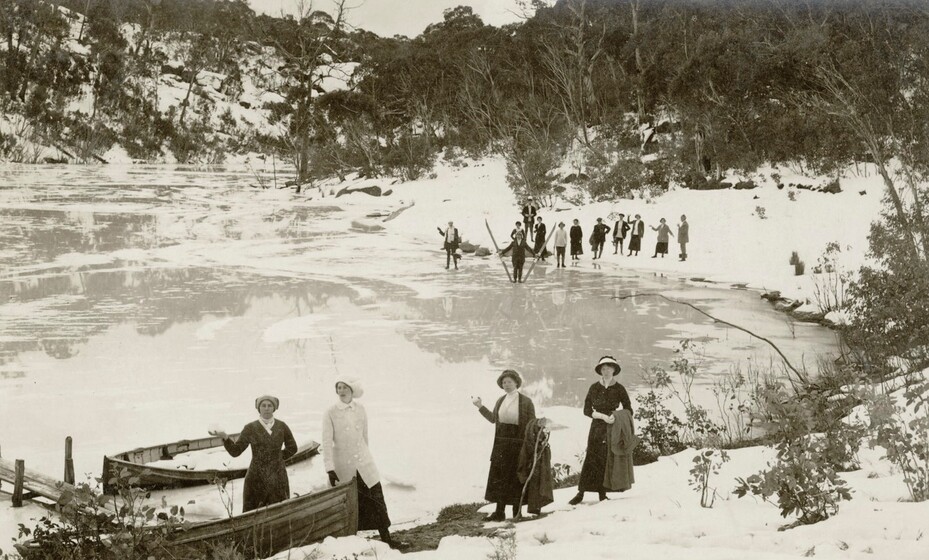 people skating on a frozen lake