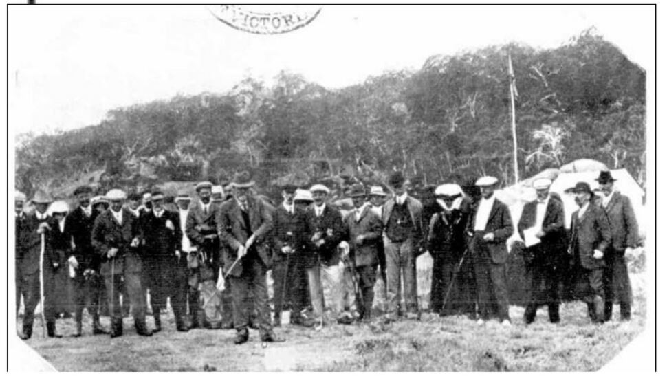  a group of people stand with assorted sticks in hand