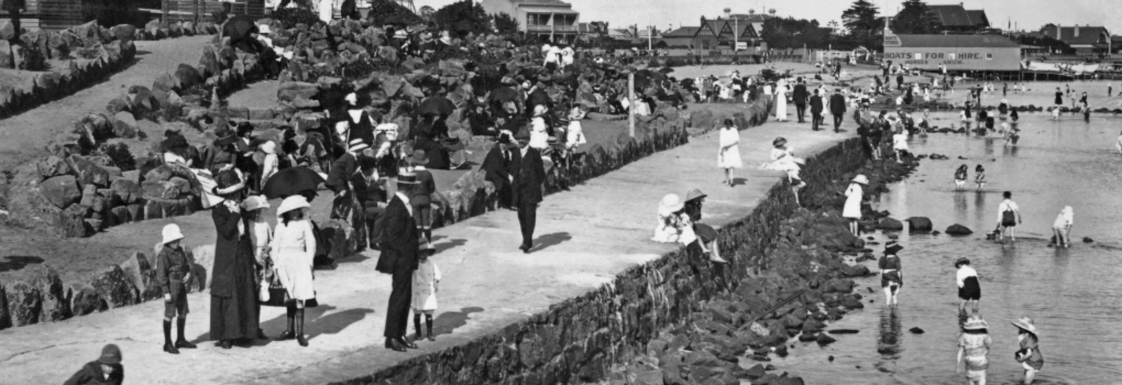people crowd a busy foreshore