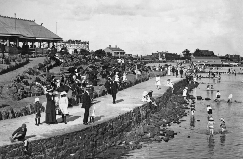 people crowd a busy foreshore