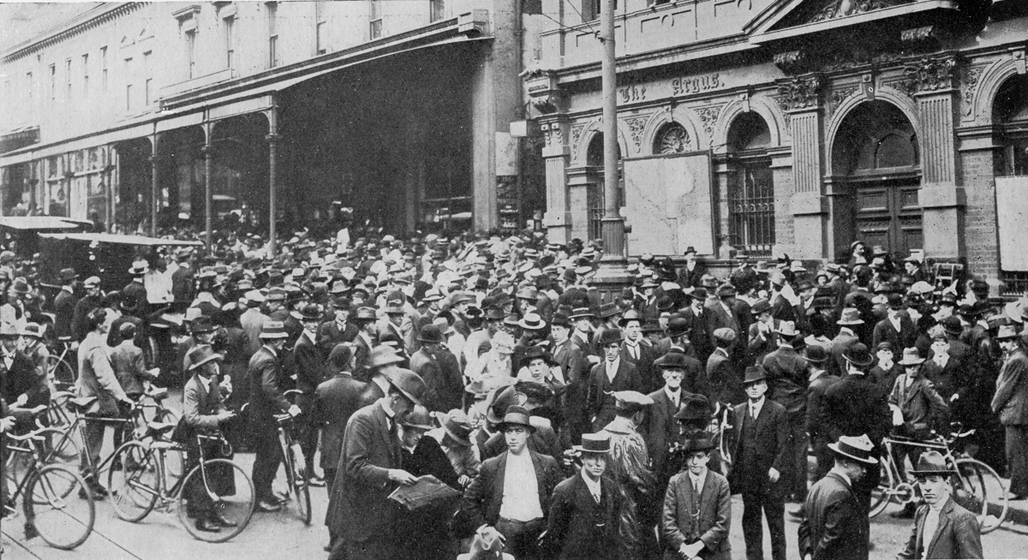 Crowd outside newspaper office