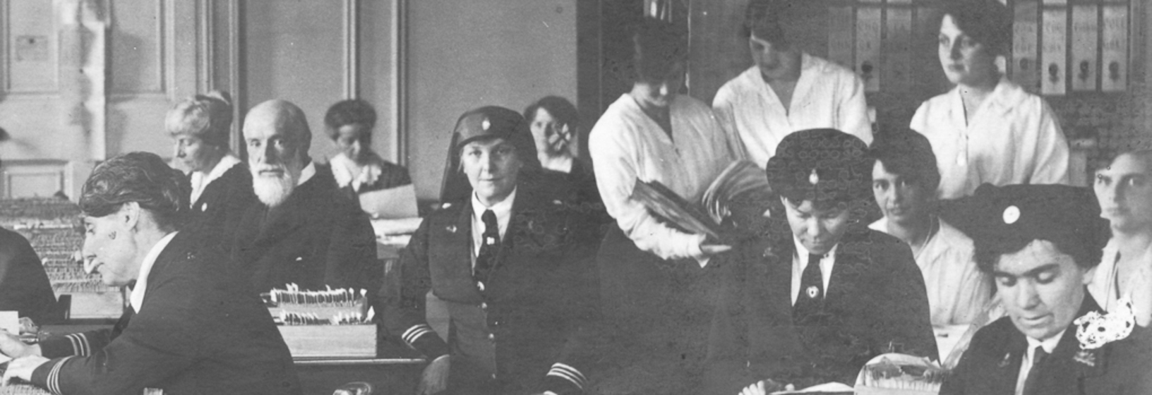 Group of men and women working in a file room