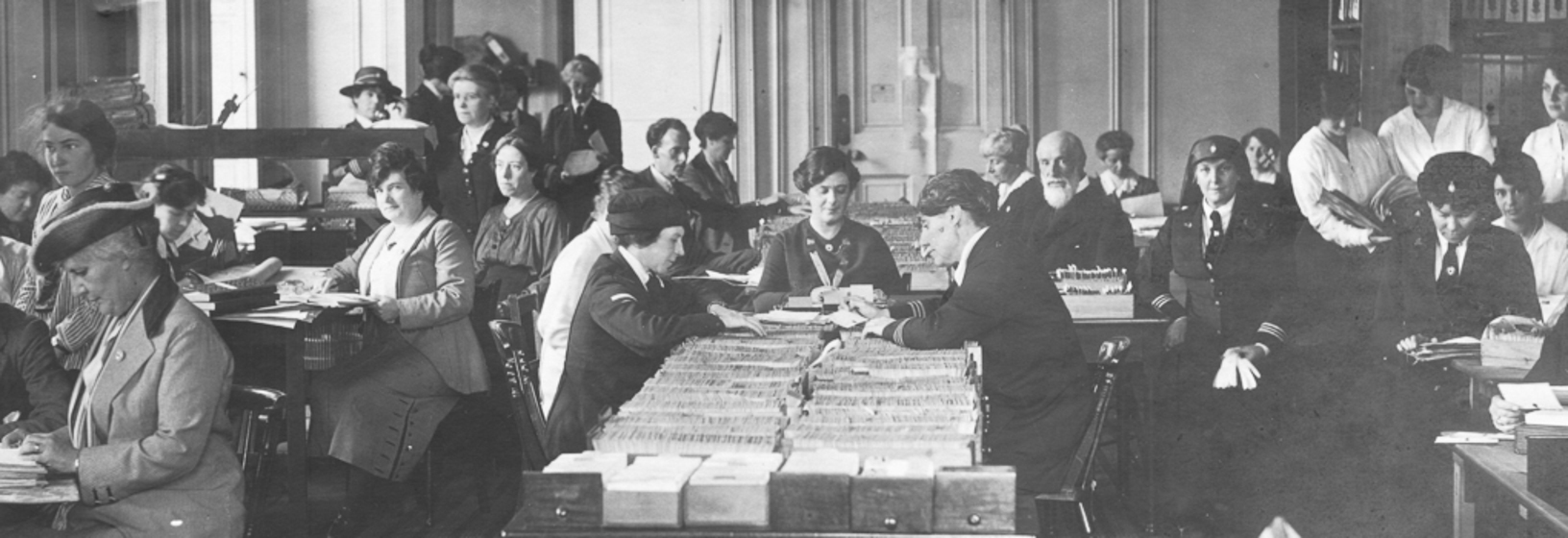 Men and women working at a table
