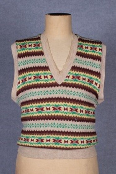 An intricate and multi-coloured hand knitted women's vest.