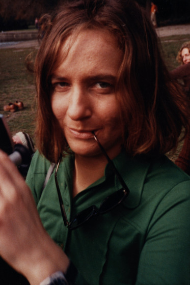Close up portrait of a woman in a park.