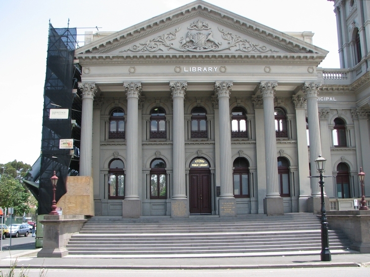Front facade of historic town hall steps and columns front view