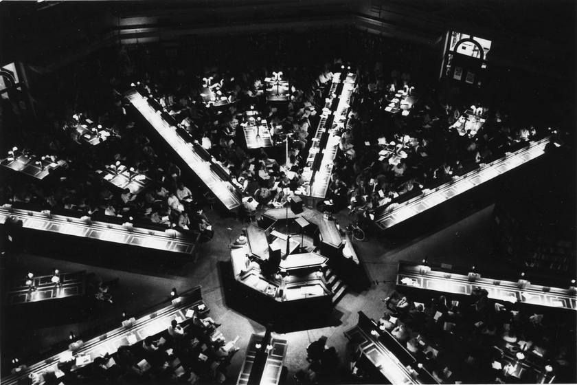 Black and white aerial image of a reading room in a large library