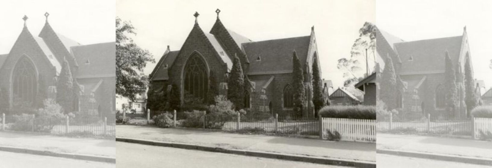 Sepia image of a church set back from the road
