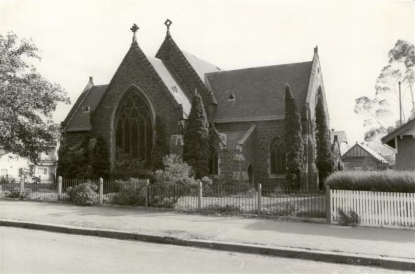 Sepia image of a church set back from the road
