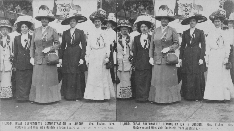 Black and white photograph of ten women in Edwardian clothing with large decorated hats.