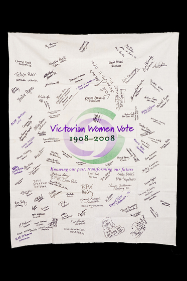 Banner with the Victorian Women Vote 1908 to 2008 logo with signatures hand written over it.