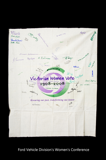 Banner with the Victorian Women Vote 1908 to 2008 logo with signatures hand written over it.