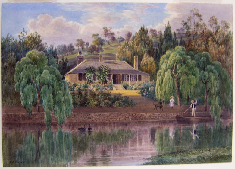 Watercolour of homestead on riverbank with a hill behind.