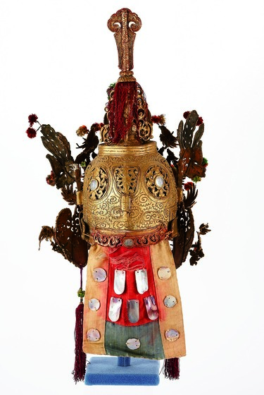 Back of ornate gilt headdress with mirrors.