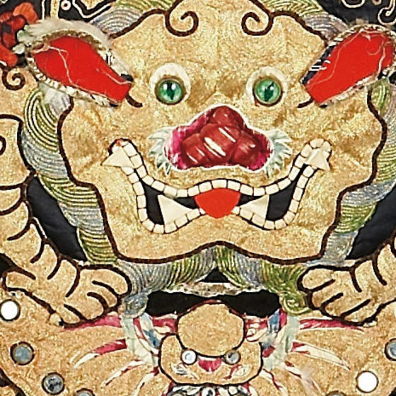 Detail of embroidery with a gold dragon. 