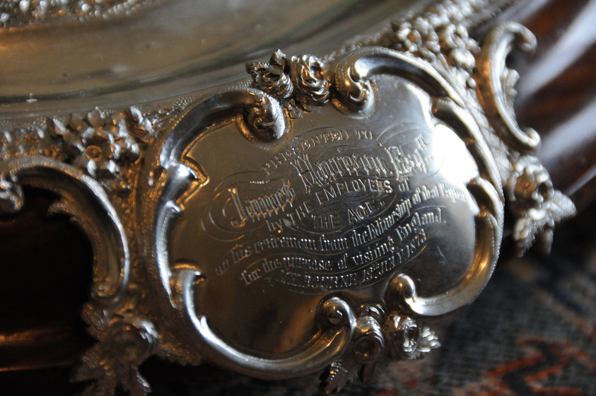 Detail of an inscription on a silver ink stand.