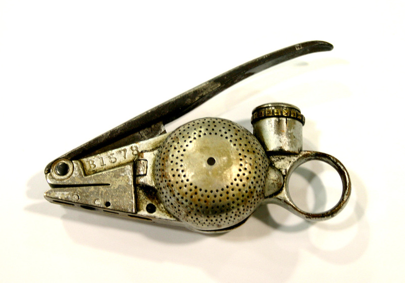 Hand held metal ticket punch.