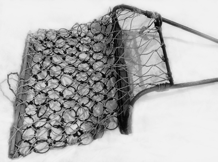 Net and chain mail device with a metal frame.