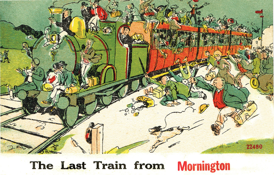 Postcard with a comic illustration of a green steam train pulling three overcrowded red carriages. People run for the train.