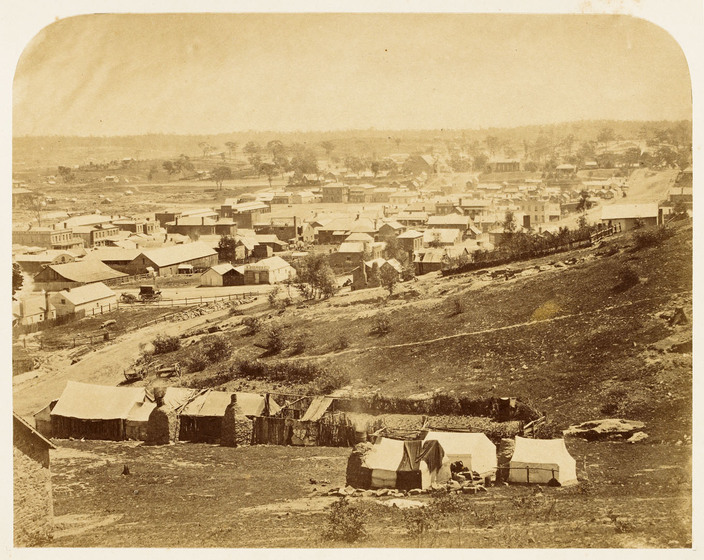 Sepia photograph of a Victorian era township.