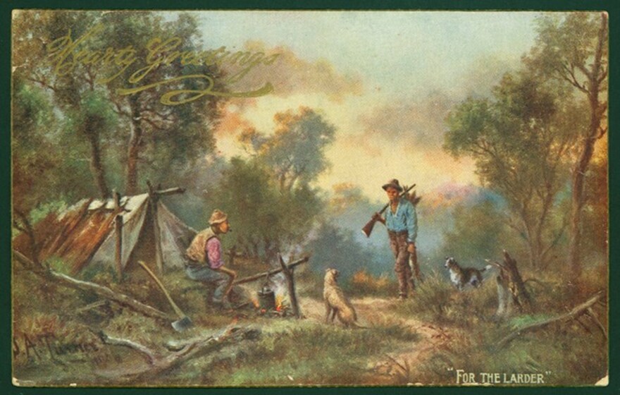 Colour Victorian era postcard with an illustration of a man sitting outside a tent beside a campfire with a dog, and a second man arriving with a dog, a gun and dead quarry. Lettering says, 'Hearty Greetings, 'For The Larder''.