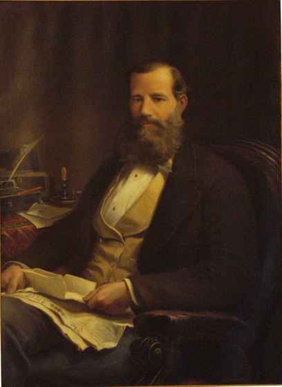 Painted portrait of a bearded Victorian gentleman sitting in a chair at a desk holding papers.