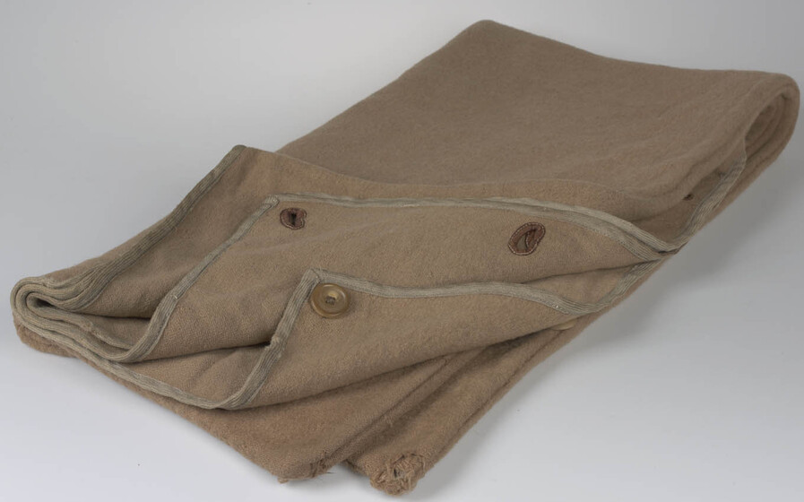 Folded thick brown cloth with eyelets.