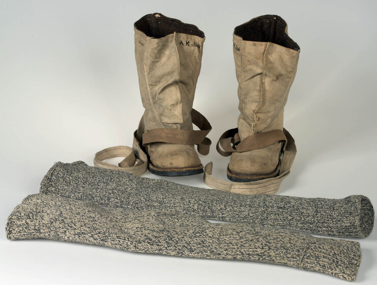 Calf-high boots with straps labelled 'A.K. Jack' and a pair of knitted leggings.