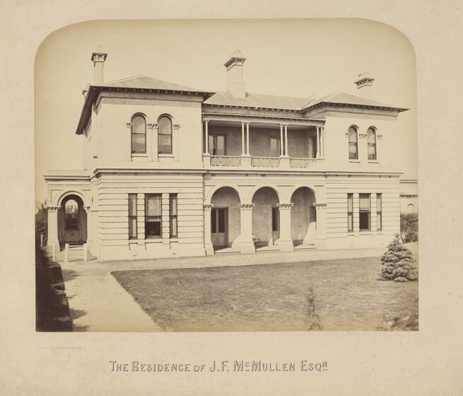 Black and white photograph of a large two-storey Victorian house with central verandas on both floors.