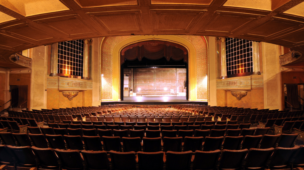 Colour photograph of an Art Deco theatre, looking toward the stage.