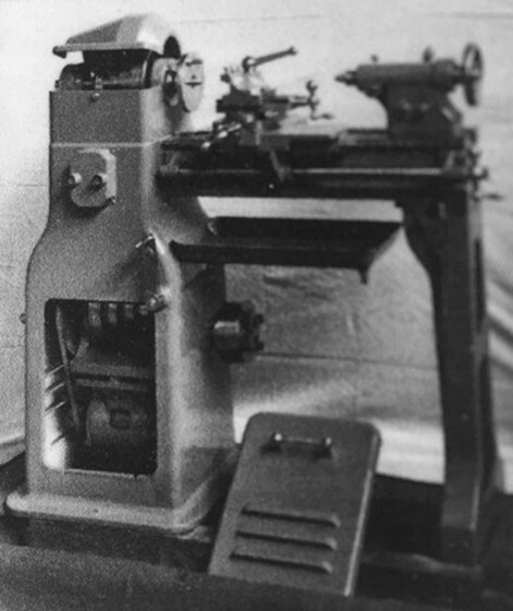 Black and white image of a metal lathe.