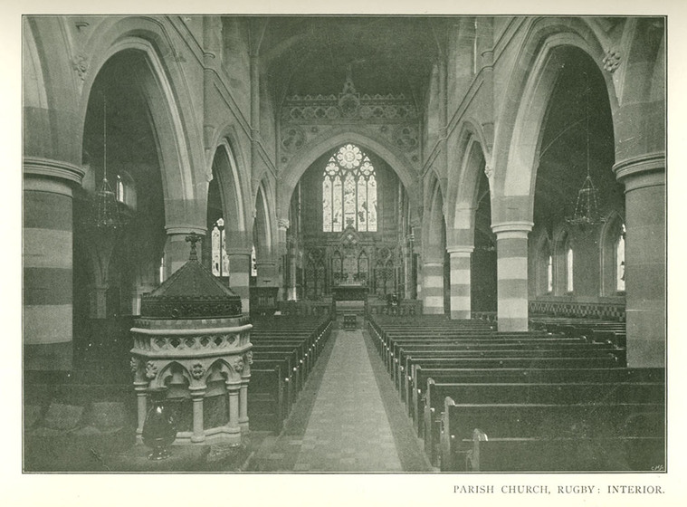 Page from a magazine with a black and white picture of the interior of a Gothic Revival church with font.