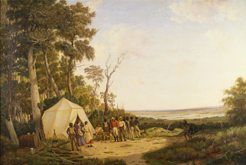 A group of men and women, both European and Indigenous, stand in front of a large tent in a bush setting. They are all staring at a man approaching the group - the man, who is white, has long hair and is wearing animal skin clothing.