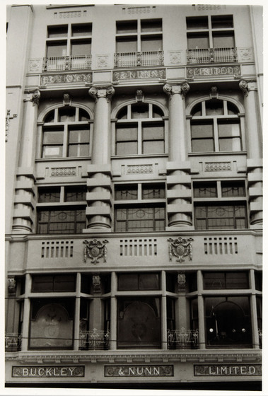 Façade of a grand multistory department store building.