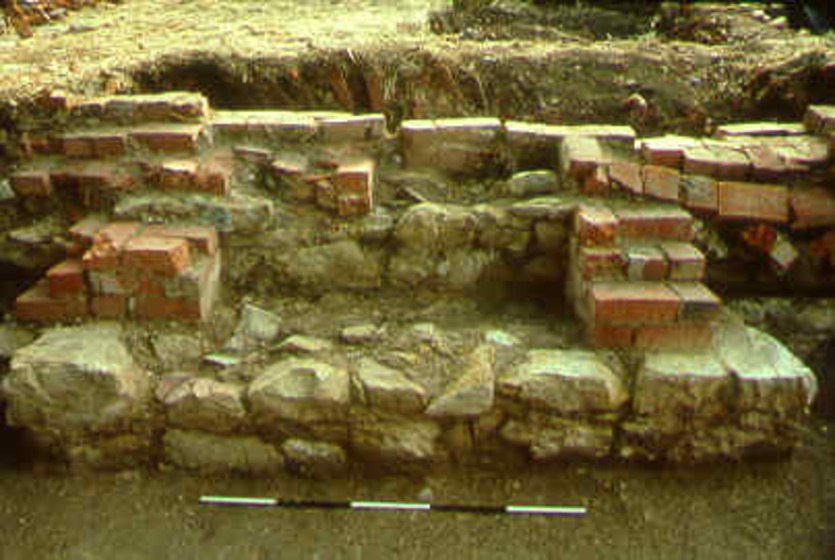 The remains of a brick fireplace.