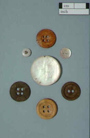 A selection of different sized and coloured buttons.