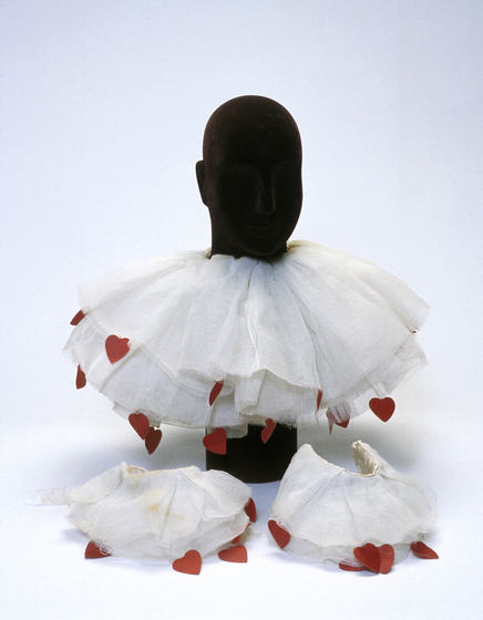White silk layered collar and cuffs with small red hearts attached to the edges.