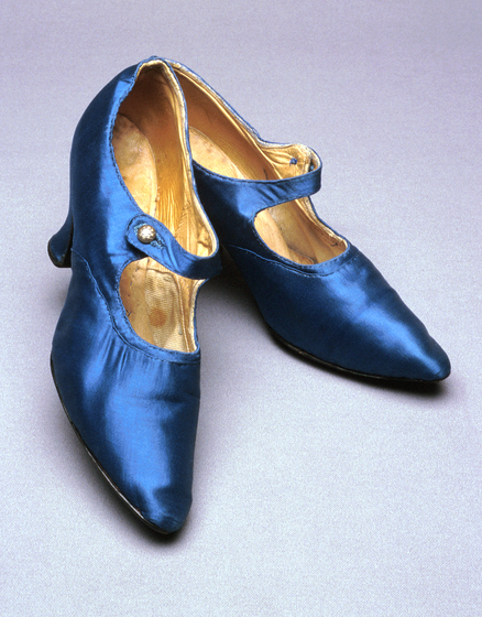 Pair of blue satin shoes with a pointed heel, ankle buckle and small stiletto heel.