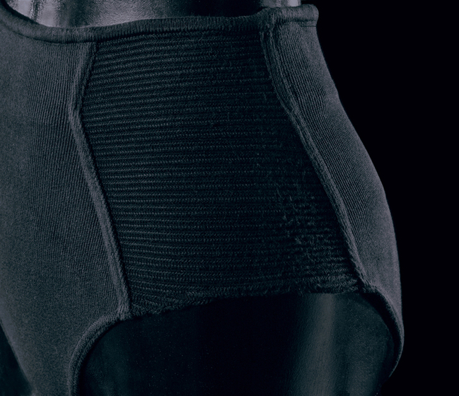 Detailed look at a pair of black stretch cotton underwear, with side paneling, on a mannequin.