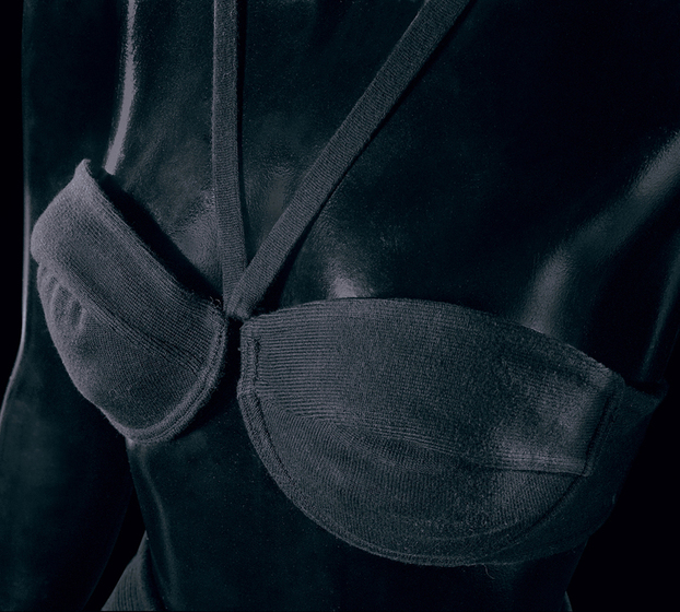 Detailed look at a black cotton bralette, with halter neck straps, on a mannequin.