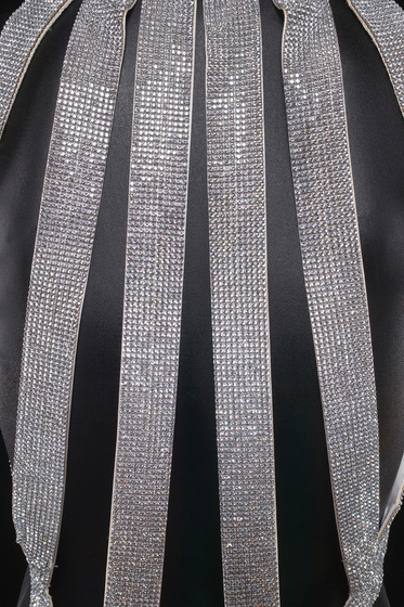 Detailed view of dress sporting Swarovski crystal back straps